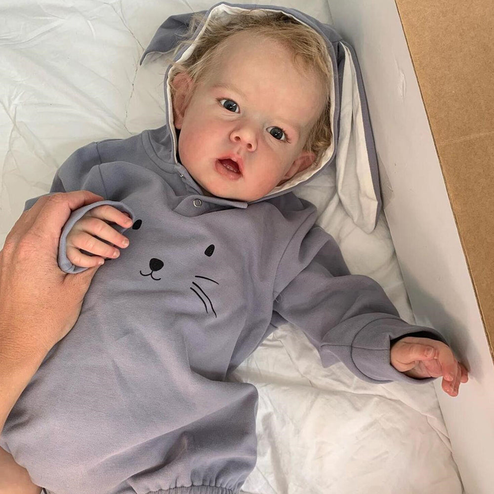 75cm Cyril reborn doll with short blonde hair and open eyes