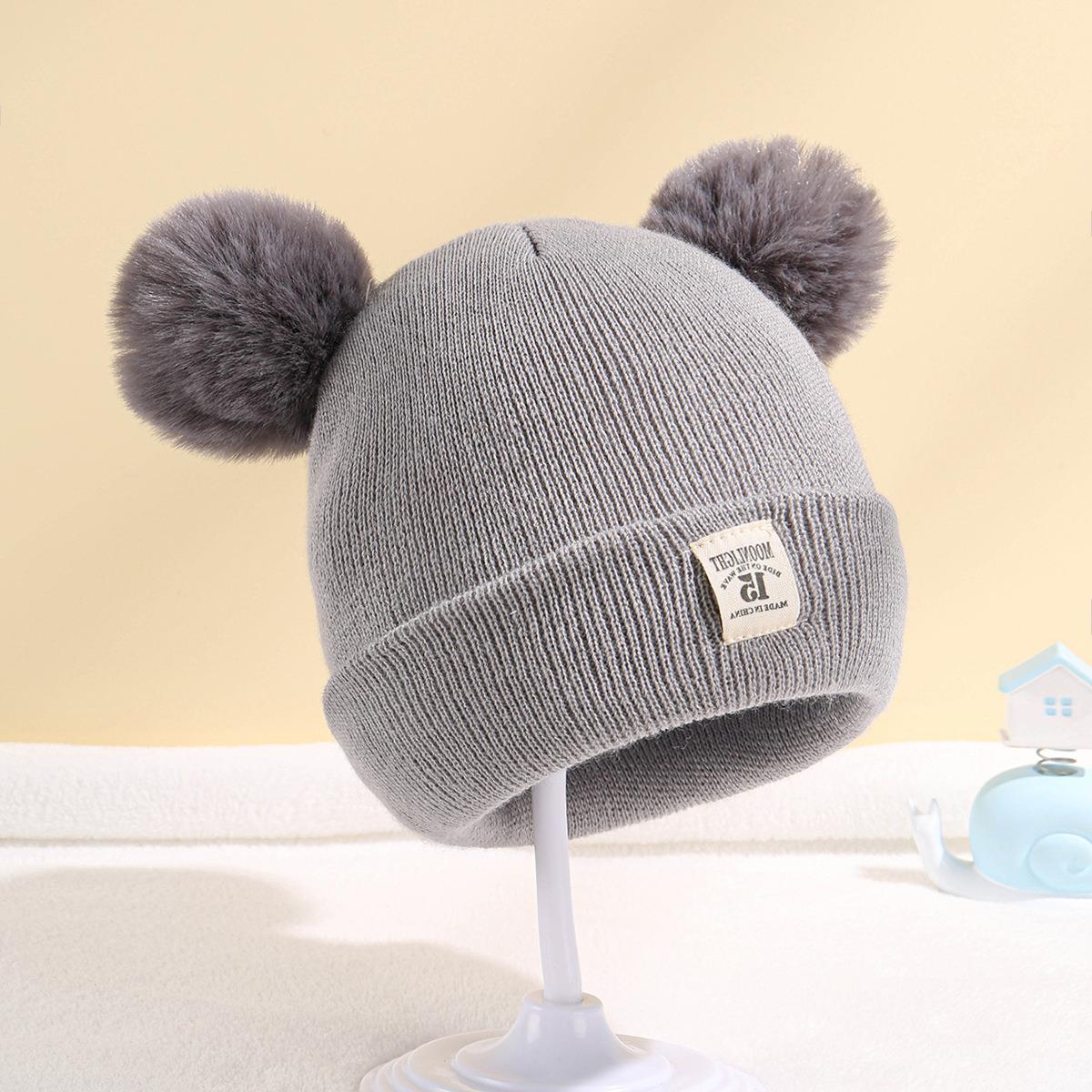 Double ball hat for children in solid color wool