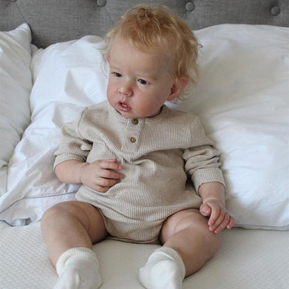 20 inch Paul reborn doll with short blonde hair and open eyes