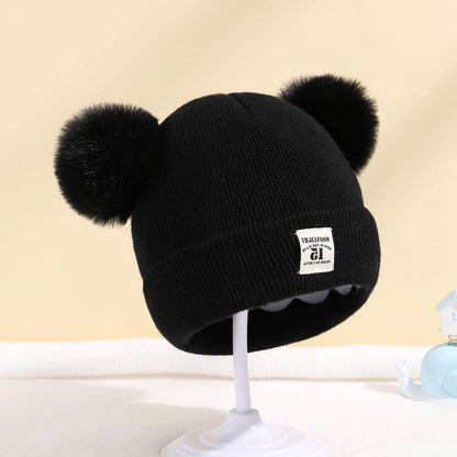 Double ball hat for children in solid color wool