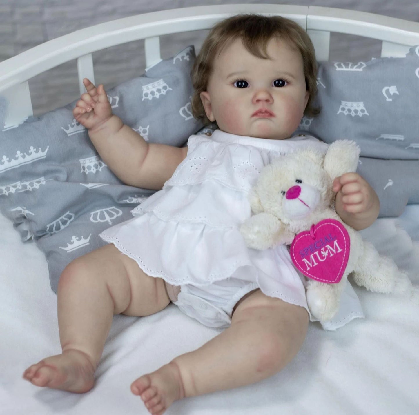 Cheryl 60cm Reborn Doll with blue eyes and brown hair