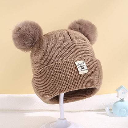 Double ball hat for children in solid color wool