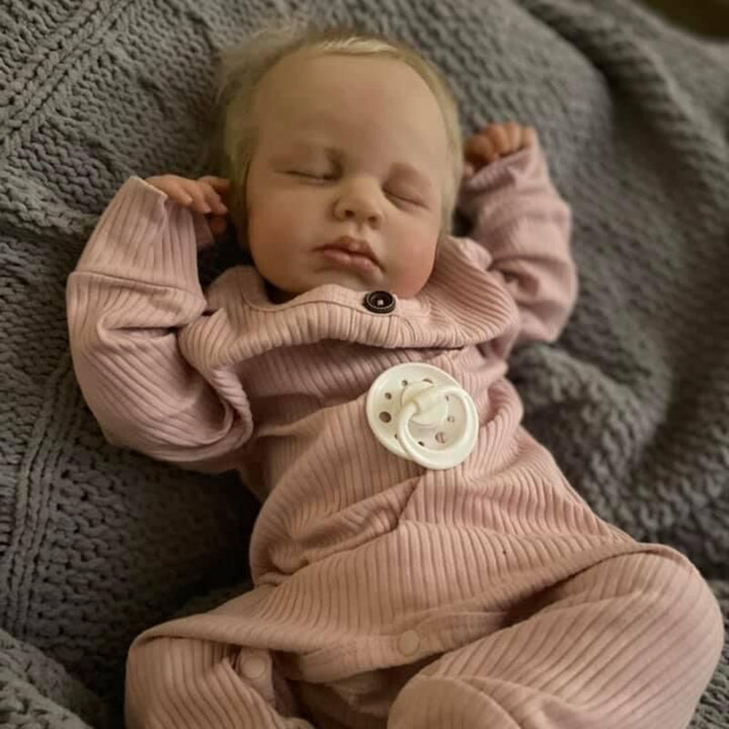 20 inch reborn doll with closed eyes and blonde hair