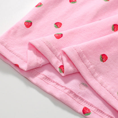 Short-sleeved cotton polo shirt for girls with strawberry-colored polka dots